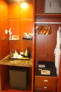 a room with a kitchen with a counter and a kitchen at Super House International in Beijing