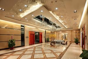 a lobby of a hotel with a chandelier at South & North International Apartment - Beijing Road -Free shuttle bus-Snack-Wellcome fruit during Canton Fair in Guangzhou