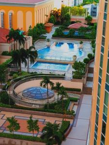 an overhead view of two pools in a building at Luckycat Homestay in Manila