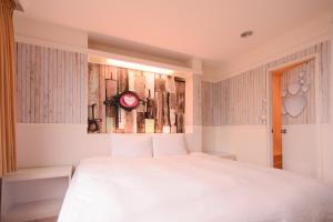 Postel nebo postele na pokoji v ubytování Kiwi Express Hotel - Zhong Zheng Branch
