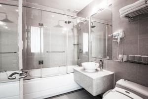 a bathroom with a shower and a sink and a toilet at Hotel Prince Seoul in Seoul +78 photos