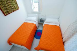 A bed or beds in a room at Villa Barbara...a 100 passi dal mare!!!!