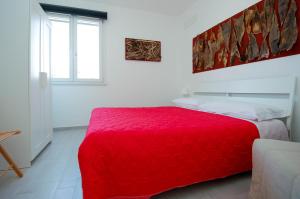 Un pat sau paturi într-o cameră la Villa Pasquale...immersa nella tranquillita'