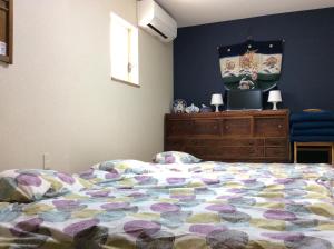 Postel nebo postele na pokoji v ubytování Tsukiji Hostel Wakayama 2