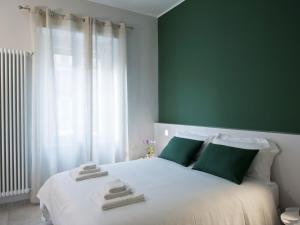 Tempat tidur dalam kamar di Bacio di Dama Lingotto