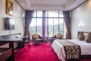 Voodi või voodid majutusasutuse Lake View Resort Hotel toas