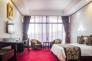 Voodi või voodid majutusasutuse Lake View Resort Hotel toas