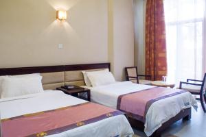 Voodi või voodid majutusasutuse Lake View Resort Hotel toas