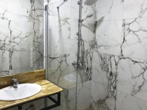 a bathroom with a shower and a sink at Brater Luxury in Bucharest +63 photos