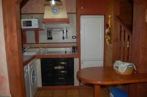 Kuchyň nebo kuchyňský kout v ubytování Asturias Apartamentos Rurales Naveces