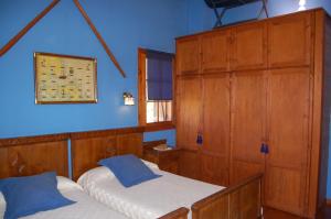 Postel nebo postele na pokoji v ubytování Asturias Apartamentos Rurales Naveces