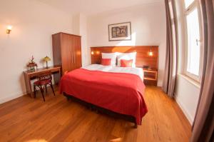 Ein Bett oder Betten in einem Zimmer der Unterkunft Pension VILLA KLEINE WARTBURG