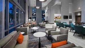 a lobby of a hotel with couches and chairs at Hyatt Place St. Petersburg/Downtown in St Petersburg