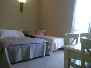 A bed or beds in a room at All'Antica Ruggine