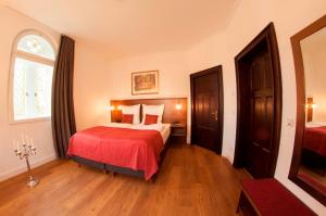 Ein Bett oder Betten in einem Zimmer der Unterkunft Pension VILLA KLEINE WARTBURG