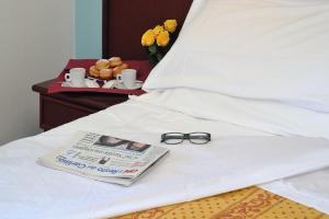 Postel nebo postele na pokoji v ubytování Hotel Vittoria - Nuova Gestione