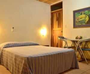 Postel nebo postele na pokoji v ubytování Villas la Paz + 37 fotografií