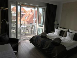 Postel nebo postele na pokoji v ubytování Hotel De Insulåner