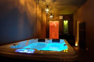 a bathroom with a hot tub in a room at La Rocca Guest House & Spa in Montefalco +109 photos