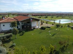 an aerial view of a resort with a large yard at Residenza Principina in Principina Terra