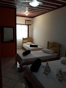 Katil atau katil-katil dalam bilik di Pousada Casa D` Guio
