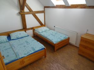 Postel nebo postele na pokoji v ubytování U Nás - Apartmán Zajíc