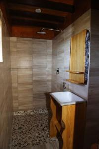 a bathroom with a sink and a toilet at Horseshoe Game Reserve in East London