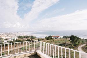 a view of the ocean from a balcony at Colina do Elétrico in Figueira da Foz