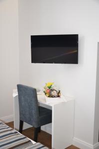 Et tv og/eller underholdning på Edificio Charles 301