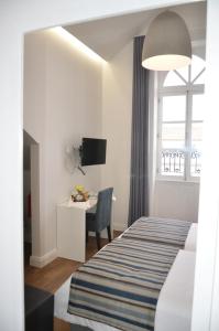 En eller flere senge i et værelse på Edificio Charles 301