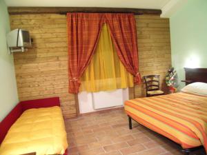 Postel nebo postele na pokoji v ubytování Les Chalets B&B