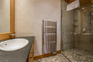 a bathroom with a sink and a shower at Le Kursaal Apartment - Chamonix All Year in Chamonix +16 photos