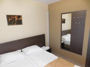 Postel nebo postele na pokoji v ubytování Papina Dacha Hotel