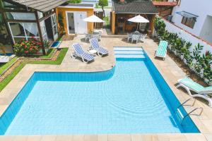 A piscina localizada em Pousada Rosa dos Ventos Juquehy ou nos arredores