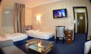 Postel nebo postele na pokoji v ubytování Hotel Austria