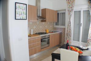 A kitchen or kitchenette at Vatican In The Moonlight Apartment
