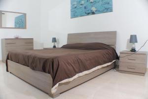 A bed or beds in a room at Vatican In The Moonlight Apartment