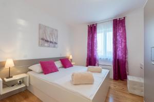 Postel nebo postele na pokoji v ubytování Villa Anja