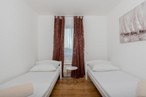 Postel nebo postele na pokoji v ubytování Villa Anja