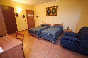 Postel nebo postele na pokoji v ubytování Albergo Corte Antica
