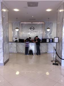 a group of people standing at a counter in a lobby at Ocean Reserve STR-01045 in Sunny Isles Beach +47 photos