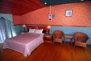 Postel nebo postele na pokoji v ubytování Paiwei Motel