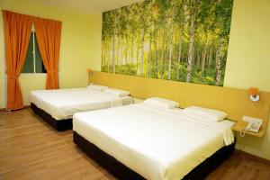 Ένα ή περισσότερα κρεβάτια σε δωμάτιο στο Tropical Villa Kuantan