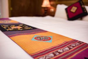 Postel nebo postele na pokoji v ubytování Sapa Luxury Hotel