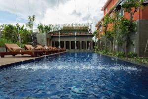 a swimming pool in the middle of a building at Golden Temple Villa in Siem Reap