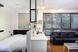 Postel nebo postele na pokoji v ubytování Hanasi 129 - Boutique Apartments