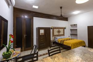 Postel nebo postele na pokoji v ubytování Merida Serviced Apartments