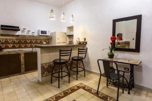 Kuchyň nebo kuchyňský kout v ubytování Merida Serviced Apartments