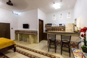 Kuchyň nebo kuchyňský kout v ubytování Merida Serviced Apartments