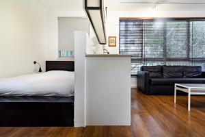 Postel nebo postele na pokoji v ubytování Hanasi 129 - Boutique Apartments